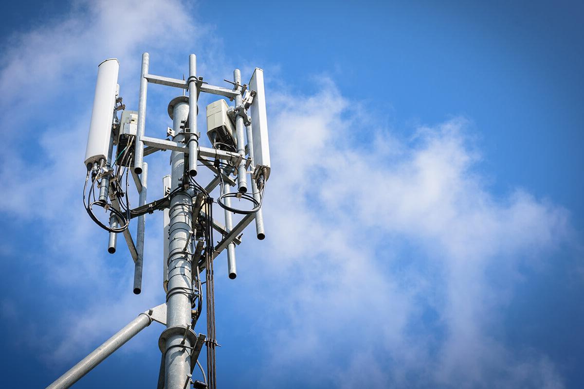 Telecoms tower in front of a blue sky